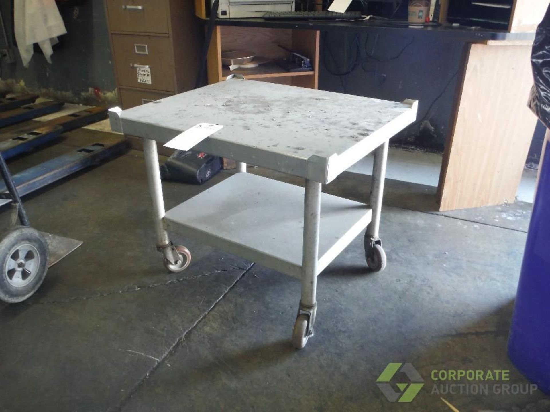 SS table, 30 in. long x 24 in. wide x 24 in. wide, mild steel legs, on casters - Image 2 of 2