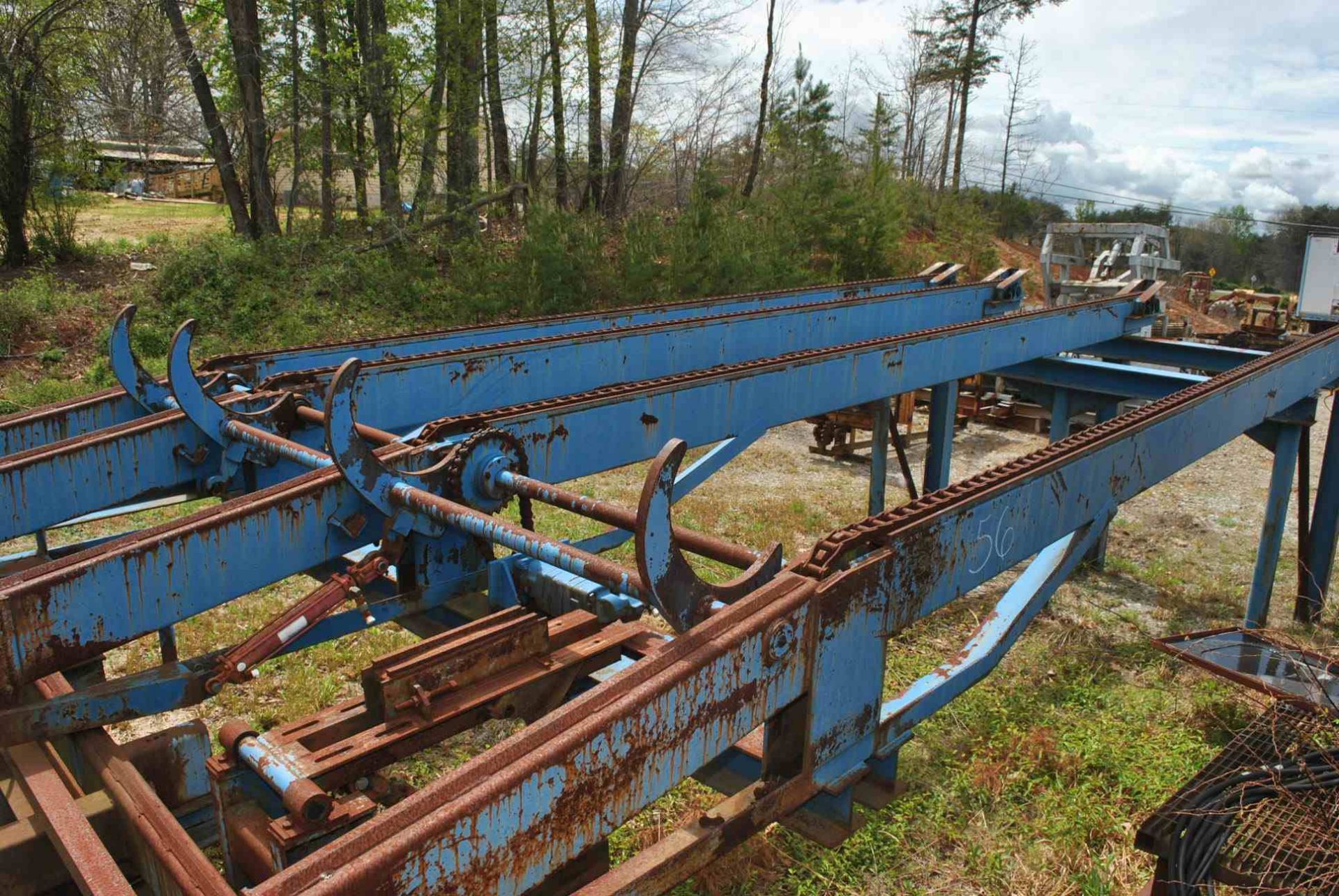 HEAVY DUTY 21' 4 STRAND LOG DECK W/4 ARM STOP & LOADER; W/HYDRAULIC DRIVE