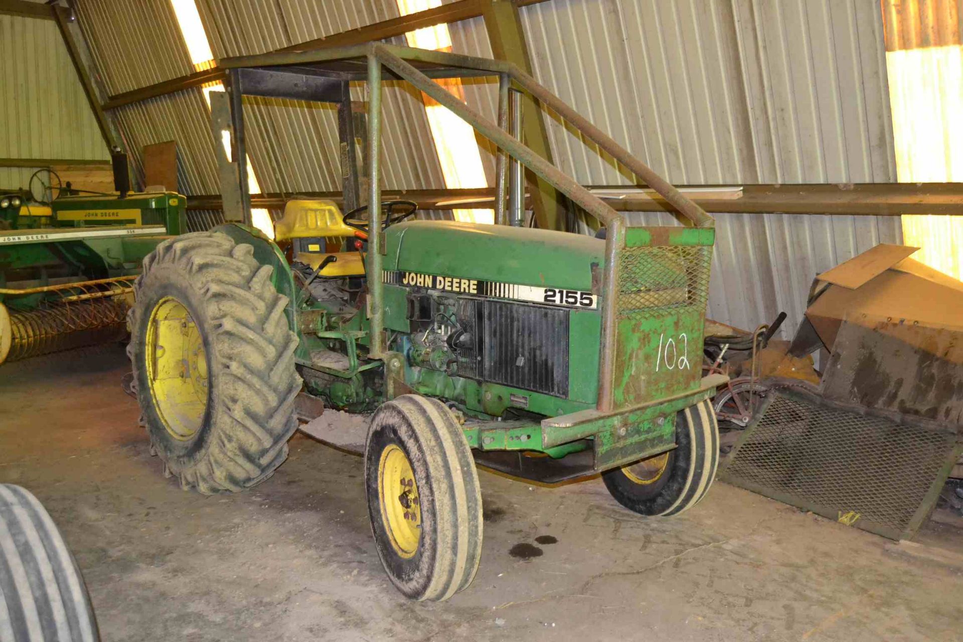 JOHN DEERE 2155 TRACTOR W/4335 HOURS; S/N-L021550634979; W/OVERSIZE TIRES; W/FORESTRY PACKAGE