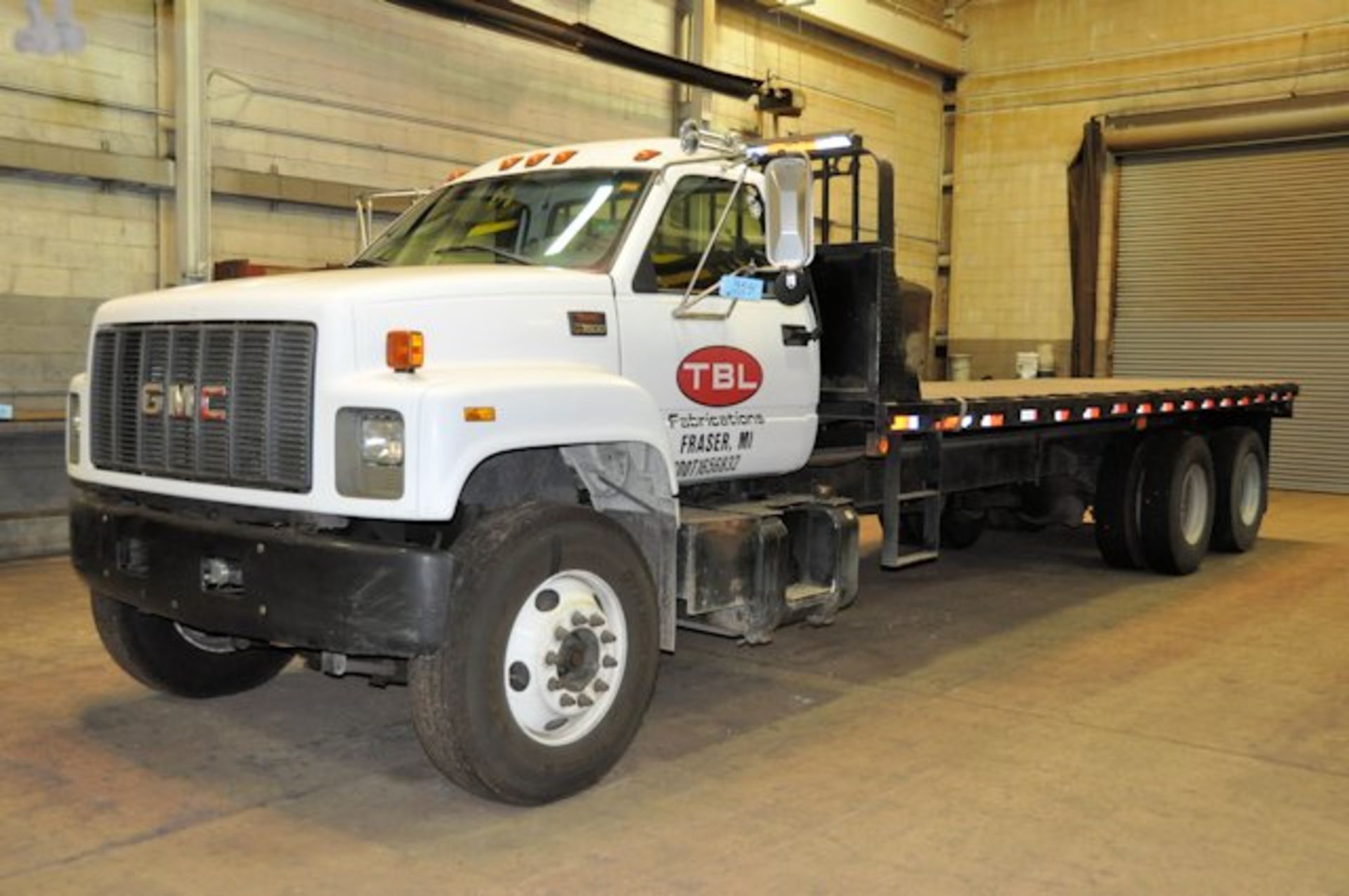 1996 GMC MODEL C7500; Tandem Axle Quad Wheeled 8' x 24' Stake Body Truck; Diesel Engine, Air Brakes