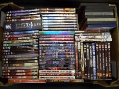 A collection of approximately 70 DVDs