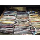 A collection of approximately 200 single records,