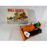 A Japanese Bulldozer, friction motor with siren heavy gauge steel by Marusan Shoten Ltd,