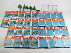 Lego - eighteen boxes of trees #430 and sixteen boxes of street lamps #433