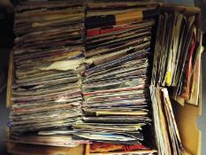 A box containing in excess of 150  vinyl single records predominantly pop music from the 1970's and