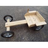 A good quality wooden go-cart by The Children's Furniture Company,