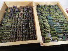 Two trays containing approx 800 hand painted miniature soldiers in groups of three's and four's (2