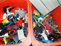 Two boxes containing a large quantity of Lego,