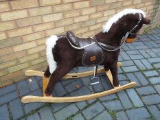 A rocking horse by 'Mamas and Papas',