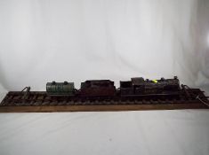 Model railways - an early 20th century O gauge display comprising 4-4-2T tank locomotive,