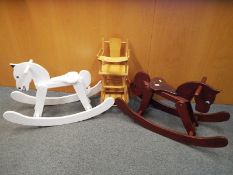 Two wooden Rocking Horses and a doll's wooden high chair which folds to form a table and chair (3)