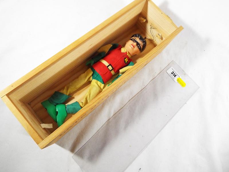 Batman - a rare doll depicting Robin, in wooden box with transparent cover,