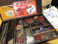 Meccano - a wooden hinge-topped case containing a collection of early Meccano with manuals and
