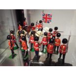 Britains diecast soldiers (and similar) - a collection of seventeen painted diecast model guardsmen