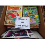 A box containing a collection of unsorted comics, magazines, children's annuals and similar,