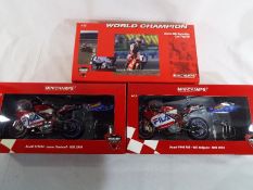 Minichamps Motorbikes - three diecast models comprising Ducati 996 Superbike World Champion 1999