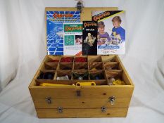 Capsela - a three drawer wooden box containing a quantity of motorised Capsela with manuals