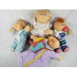 Four Cabbage Patch dolls