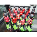 Britains diecast soldiers - a collection of twenty painted diecast model Grenadier Guards and a