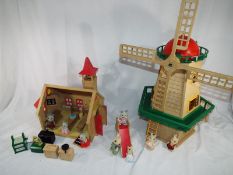 Sylvanian Toys by Tomy - a toy windmill and church school with furniture, a kitchen set,