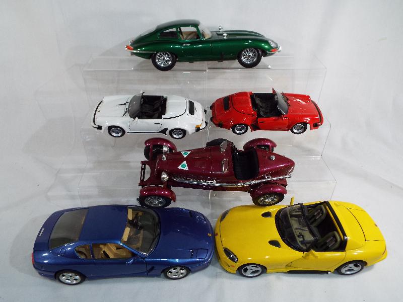 A collection of four Burago diecast model motor vehicles 1/18 scale to include a Ferrari 456 GT,