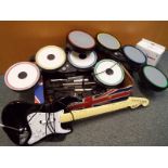 A collection of computer musical instruments to include drums, fender stratocaster toy guitar,