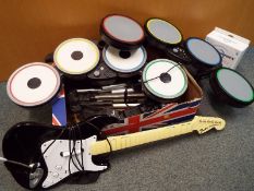 A collection of computer musical instruments to include drums, fender stratocaster toy guitar,