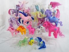 A collection of approximately twelve My Little Ponies
