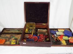 Meccano - A period mahogany chest with internal trays containing a good collection of early Meccano.
