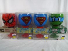 Action Heroes - four large glass goblets,
