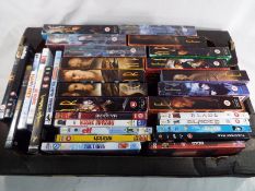 A collection of approximately 45 DVDs to include sci-fi,
