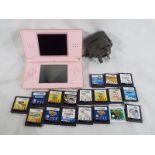 Nintendo - a Nintendo DS with a quantity of games and mains lead