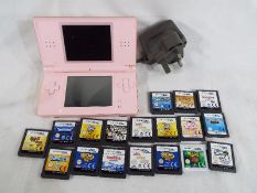 Nintendo - a Nintendo DS with a quantity of games and mains lead