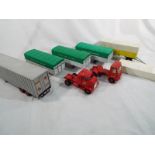Dinky Toys - a small collection of trucks and trailers comprising 3 x AEC trailers,