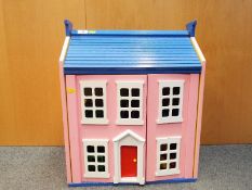 A wooden front opening doll's house with