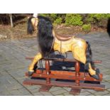 A hand-made wooden rocking horse, 99 cm