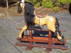 A hand-made wooden rocking horse, 99 cm