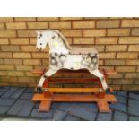 A vintage child's wooden rocking horse a