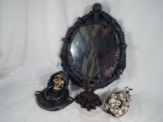 Gothic / Halloween interest - a mixed lot of Novelty Skulls to include a wall mirror,