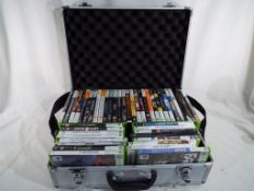 XBox - a good quality flight case containing approximately 45 XBox games