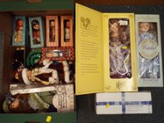 A collection of dressed dolls, predominantly boxed,
