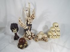 Gothic / Halloween interest - a collection of novelty skulls to include The Reaper's Stare candle