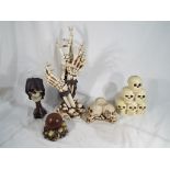 Gothic / Halloween interest - a collection of novelty skulls to include The Reaper's Stare candle