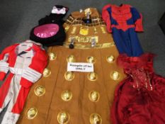 A box of assorted fancy dress costumes to include Dalek,