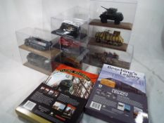 A small collection of diecast model military vehicles by Atlas and similar,