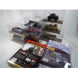 A small collection of diecast model military vehicles by Atlas and similar,