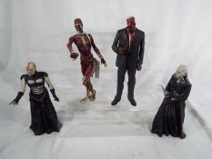 Four Hellraiser figurines entitled Frank, Tracy,