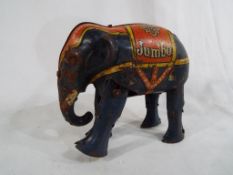 An early 20th century tin-plate clockwork toy Elephant marked Jumbo,