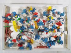 A quantity of vintage Smurfs.