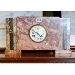 French striking mantel clock in rouge marble case,